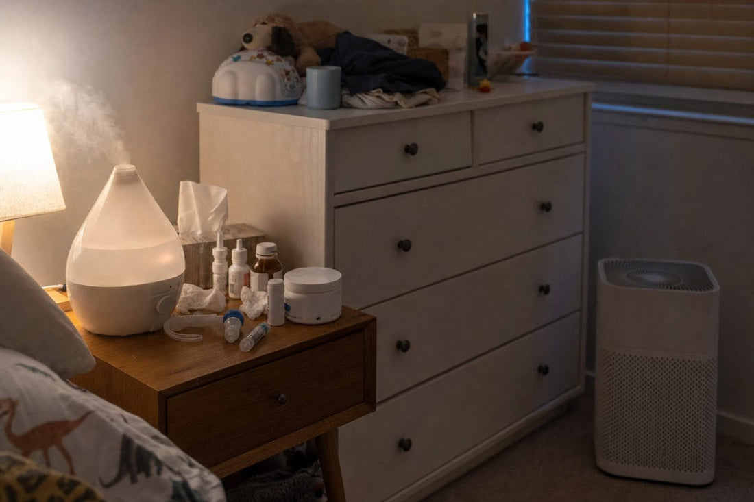 Bedside table crowded with vaporiser, saline and medicines