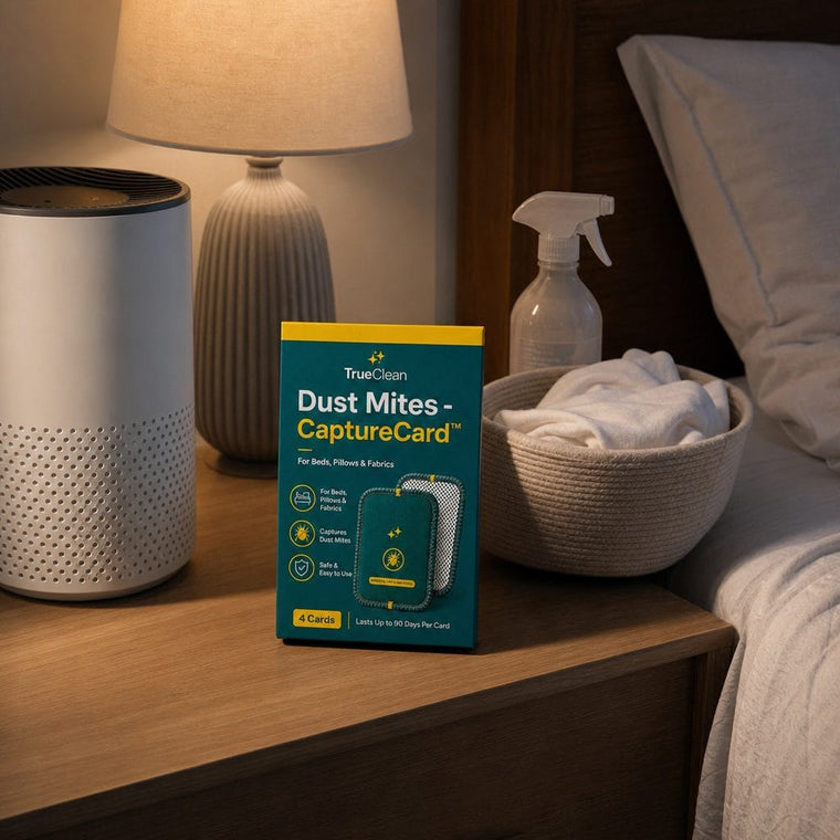 Air purifier, spray, laundry, and CaptureCards beside a bed