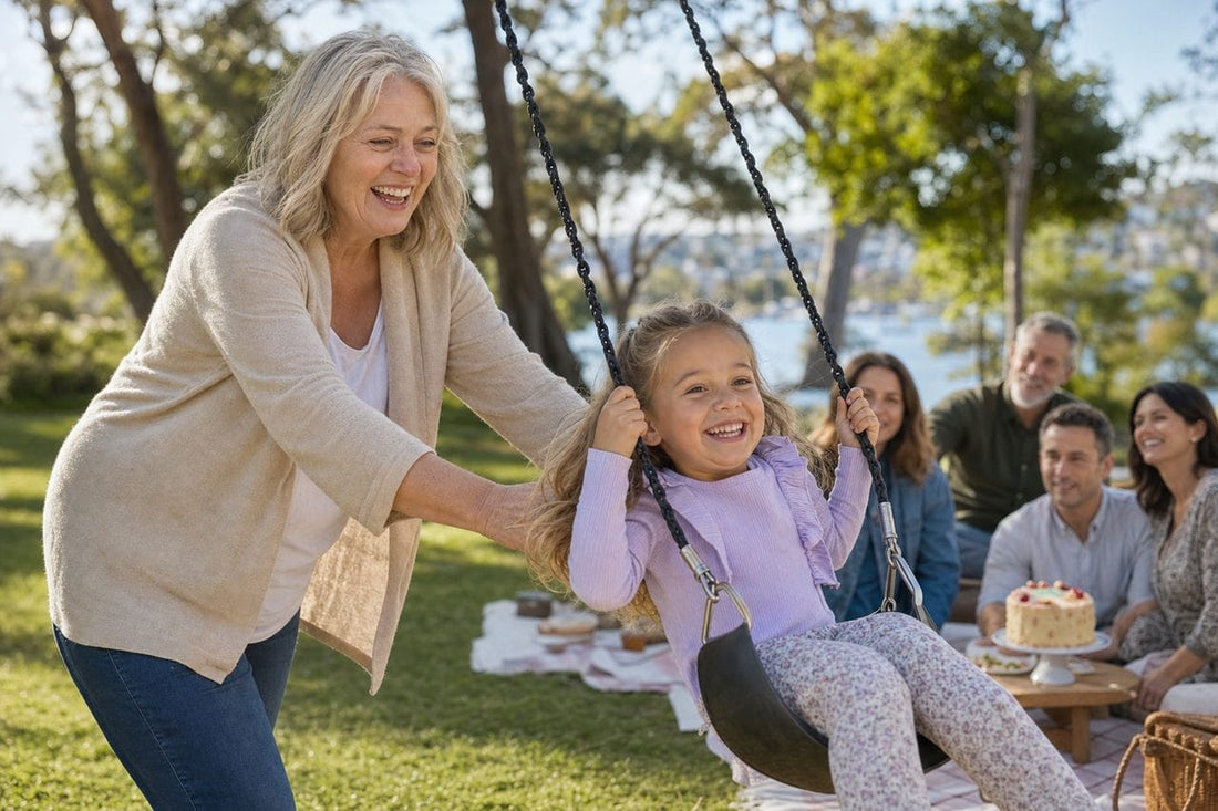 Sarah pushing her granddaughter on a swing at a family picnic