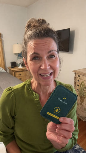 Creator showing a CaptureCard in a bedroom