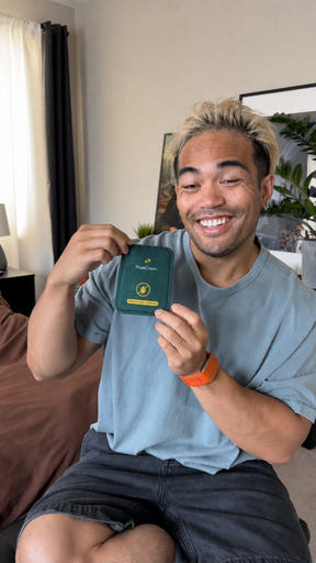 Creator holding a CaptureCard at home