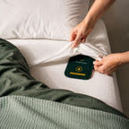 Placing a sealed CaptureCard beneath a fitted sheet