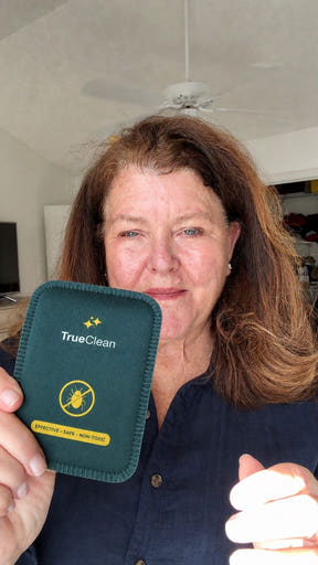 Creator holding a CaptureCard at home