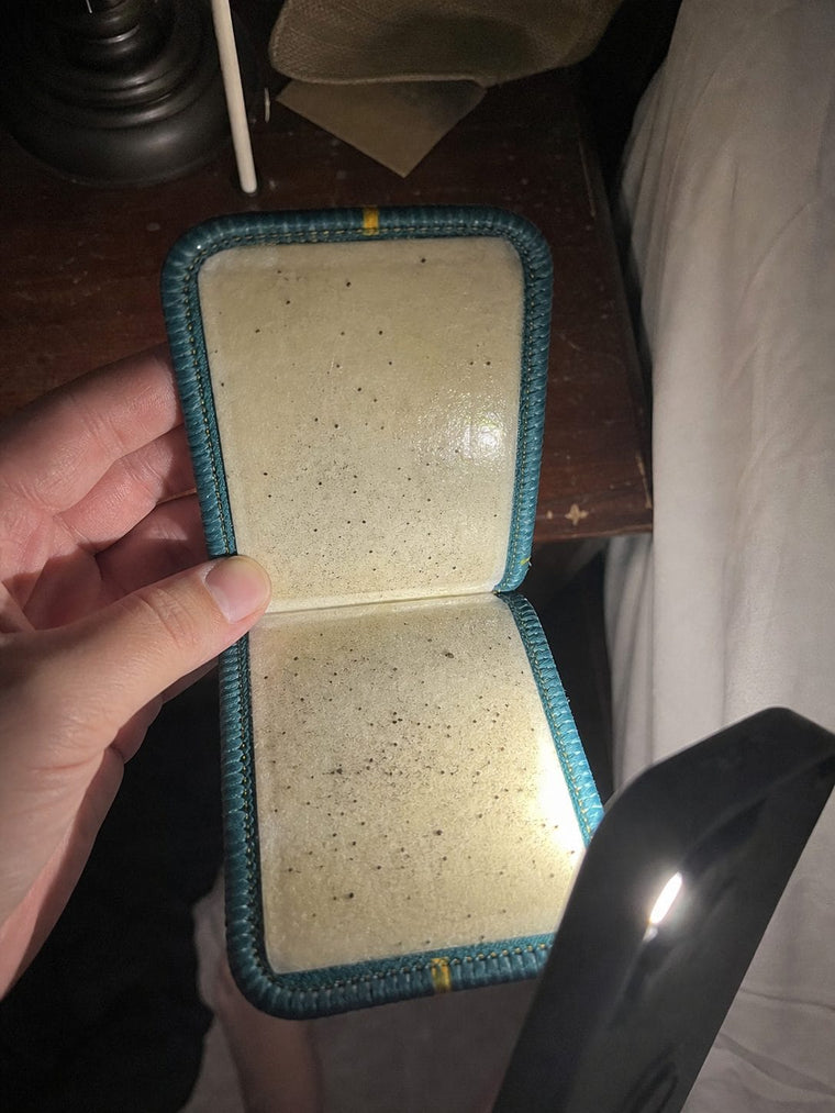 Opened CaptureCard with visible dots on the adhesive