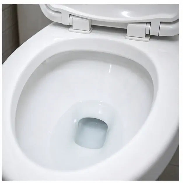 thumbnail — same toilet bowl, sparkling clean white porcelain, no ring, lid up, cinematic lighting. The "after" companion shot.